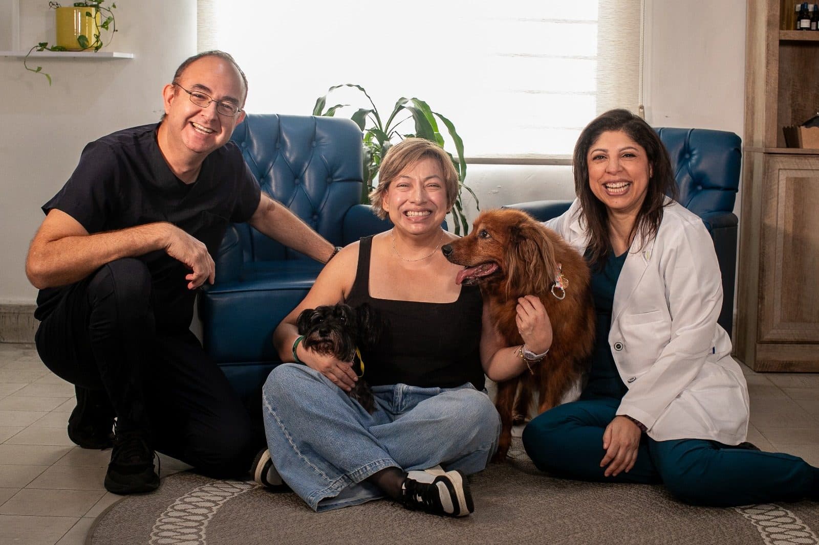 Rosy with clients and their dogs at the clinic